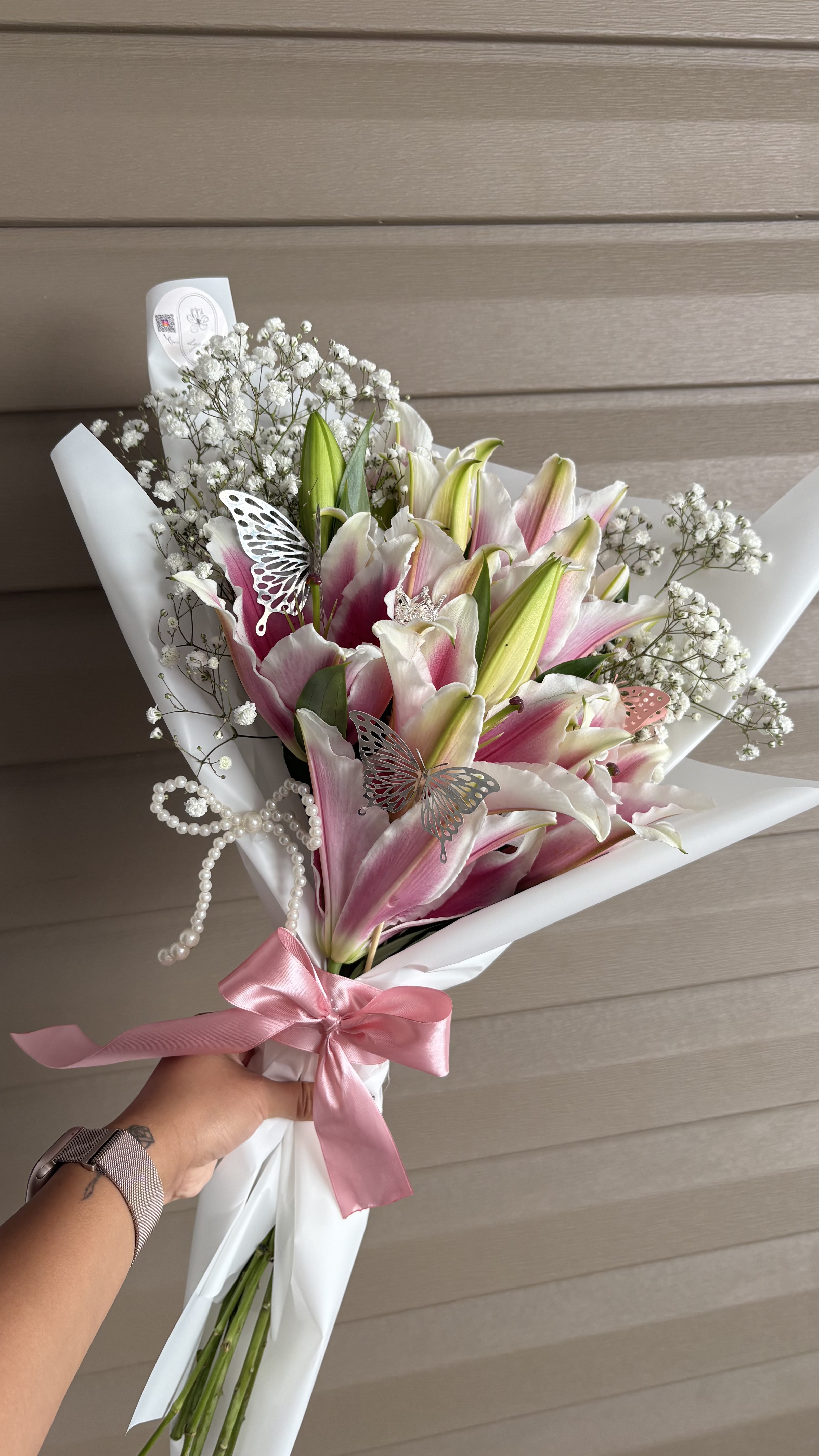 Pink stargazer lily bouquet with butterfly and pearl details