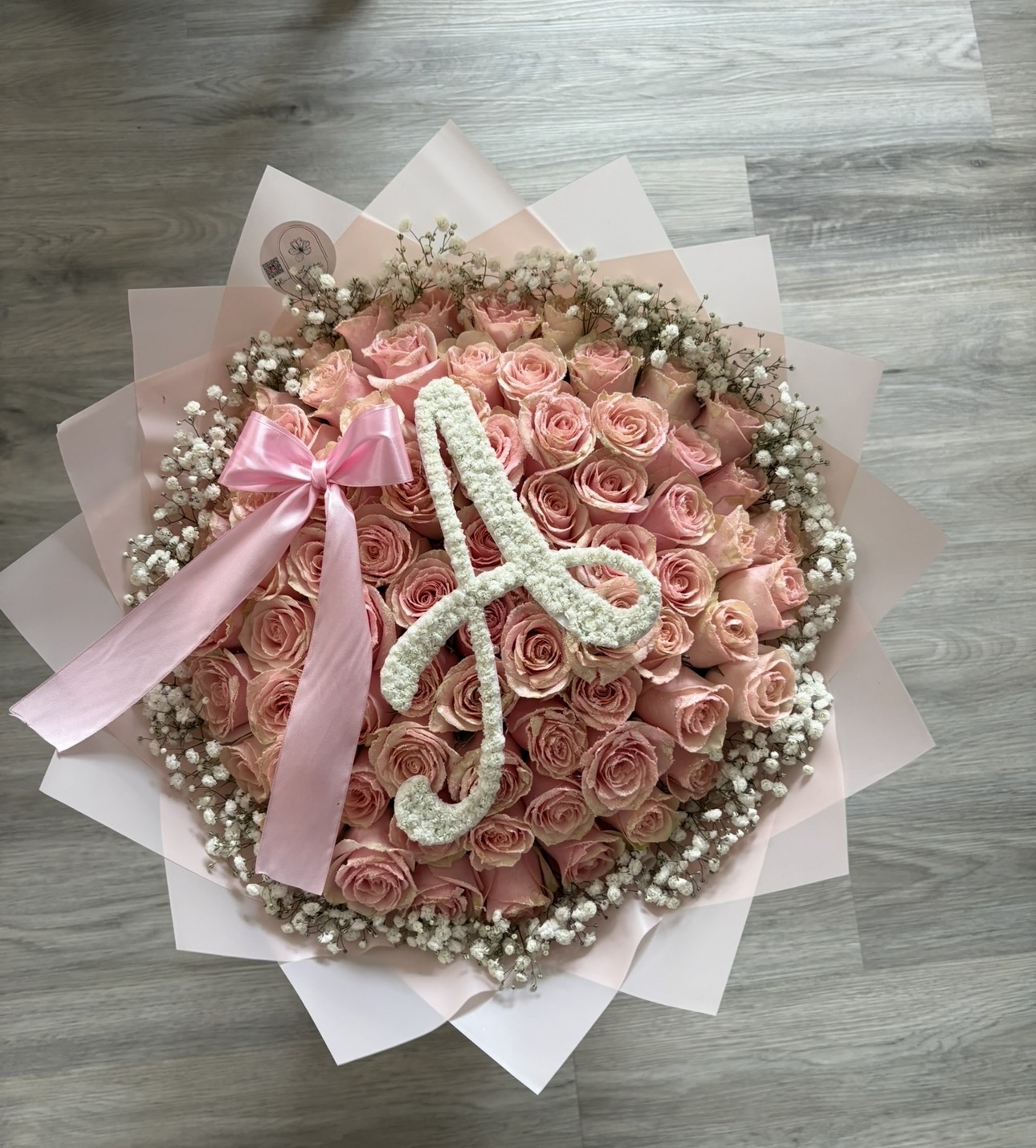 Pink rose bouquet with baby's breath letter and satin bow